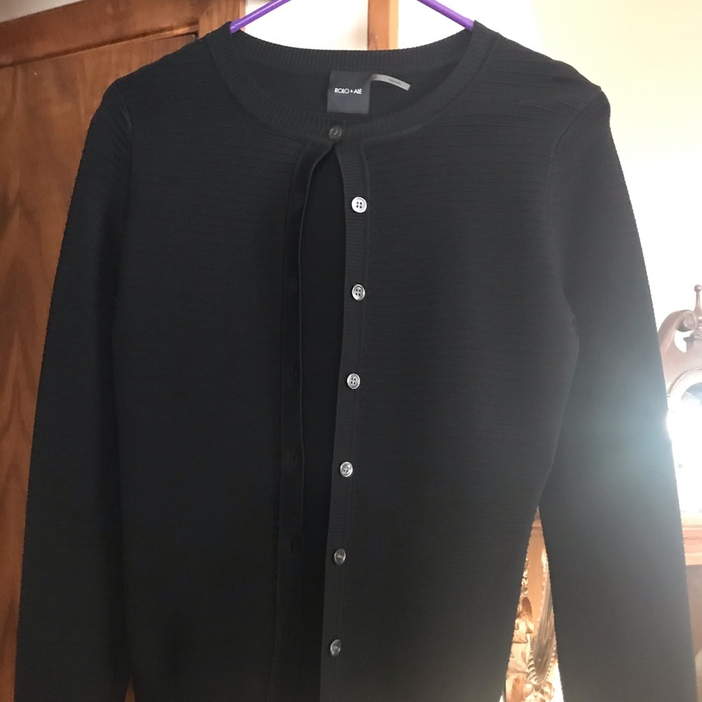 New without tags Black Sweater. Gorgeous garment.